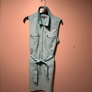 Women’s dress with great brass like buttons and zipper. Tie belt and fun color!